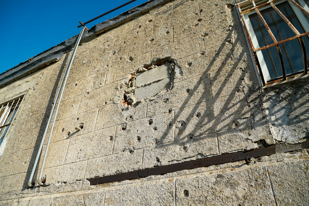Projects building exterior being inspected for water damage