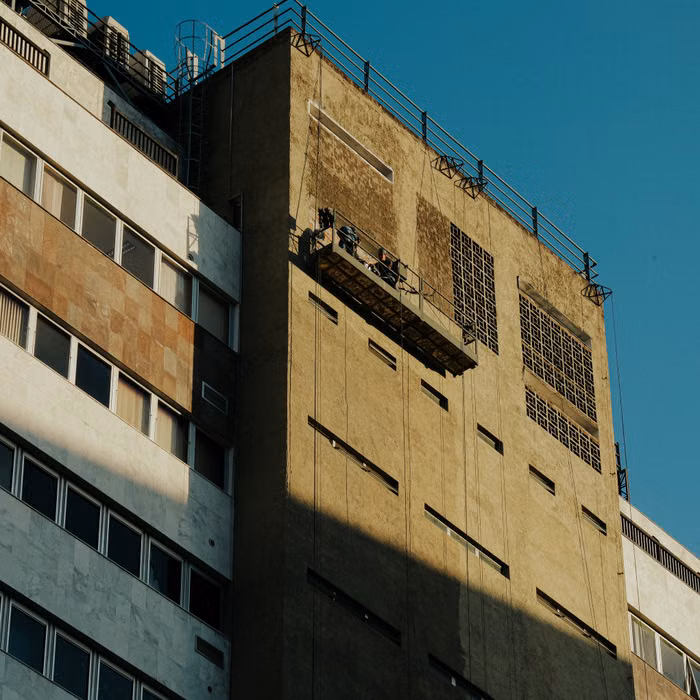 Projects technician inspecting water intrusion in a building