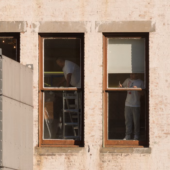 Projects construction team working on a property exterior