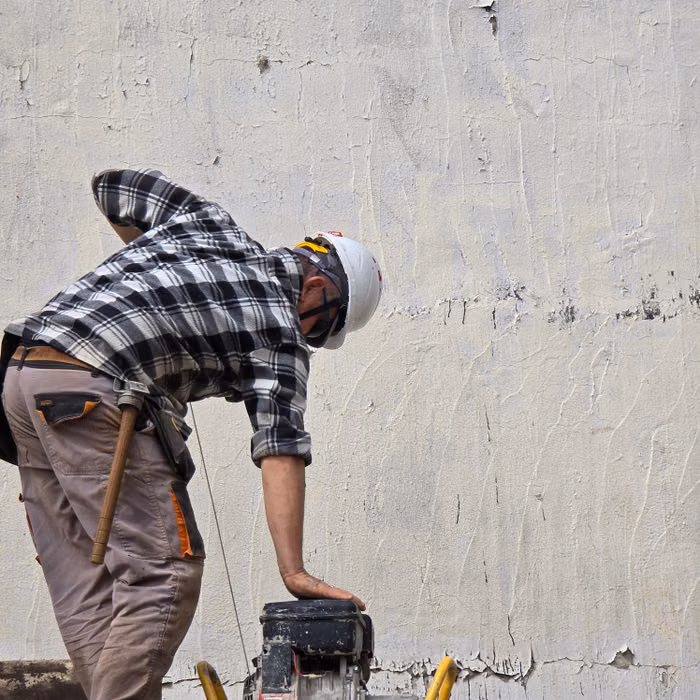 Projects craftsman repairing a residential wall